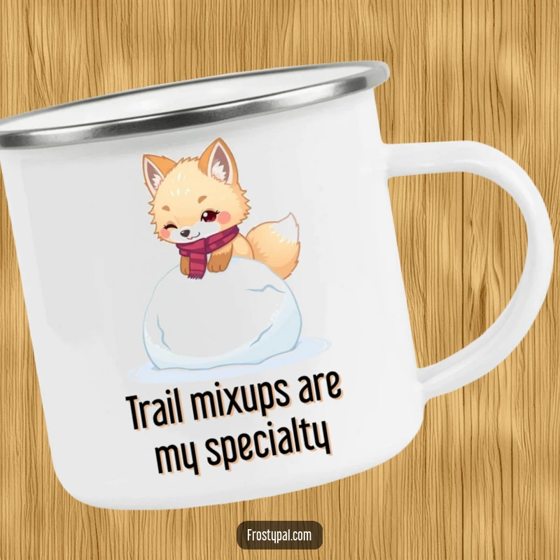 Funny arctic fox camping mug illustrates a cute fox wearing a scarf, humorously stumbling over a giant snowball.